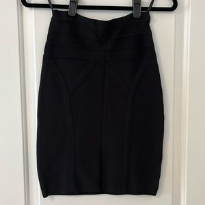 Black BEBE mini skirt with detail